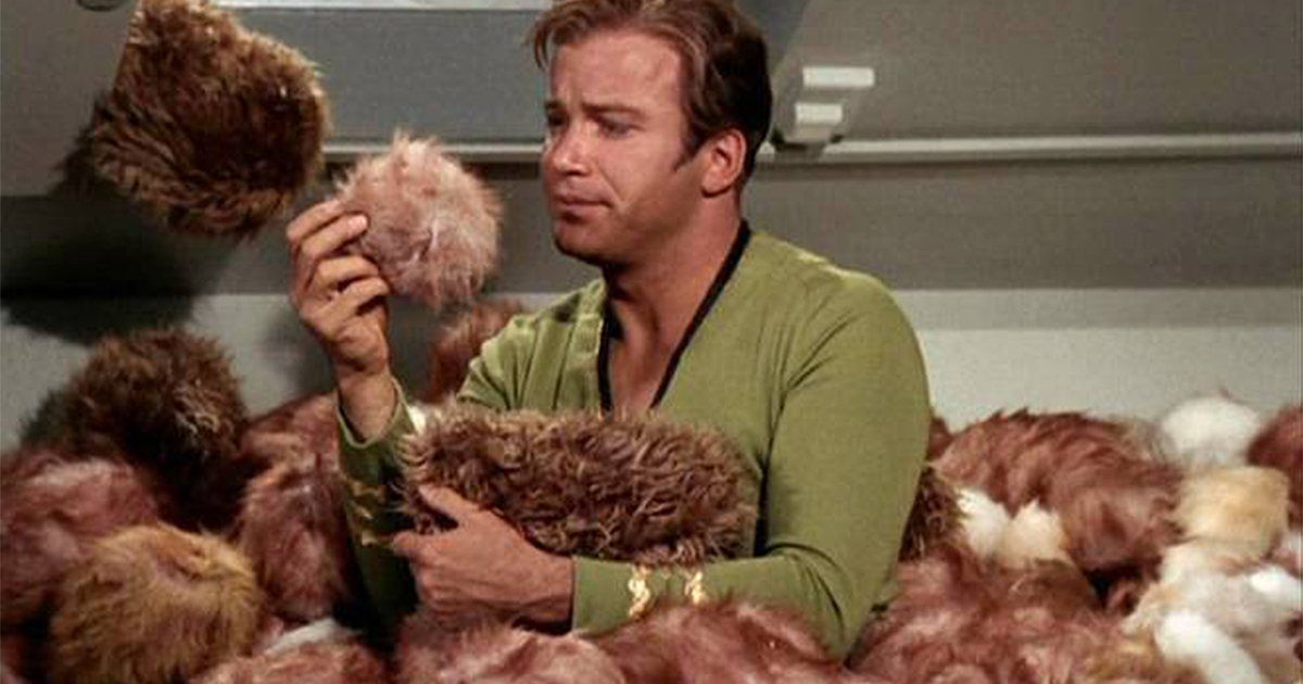 Captain Kirk surrounded by Tribbles